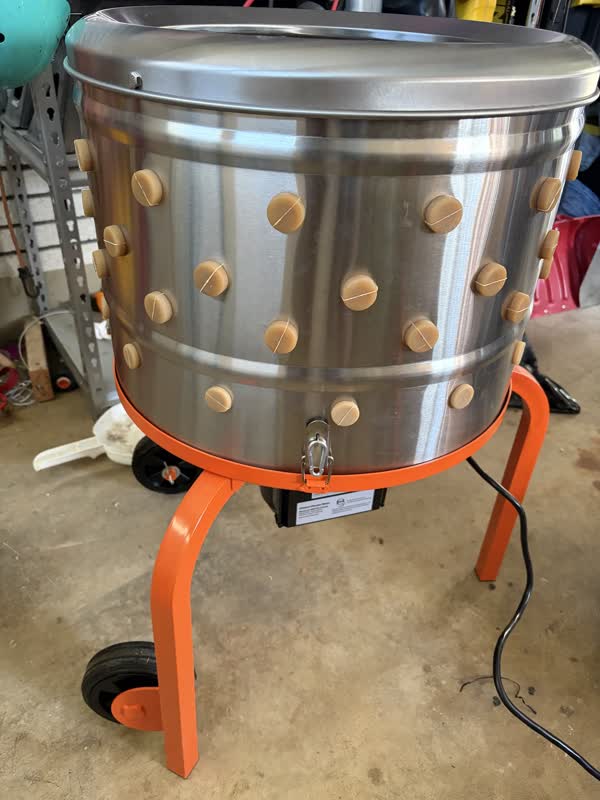 Automatic chicken plucker with orange legs